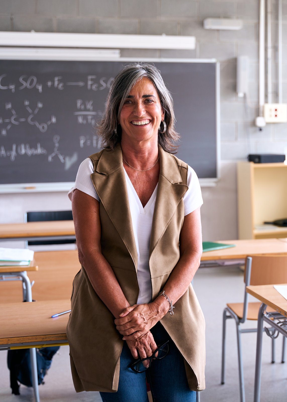 Educator standing in a classroom