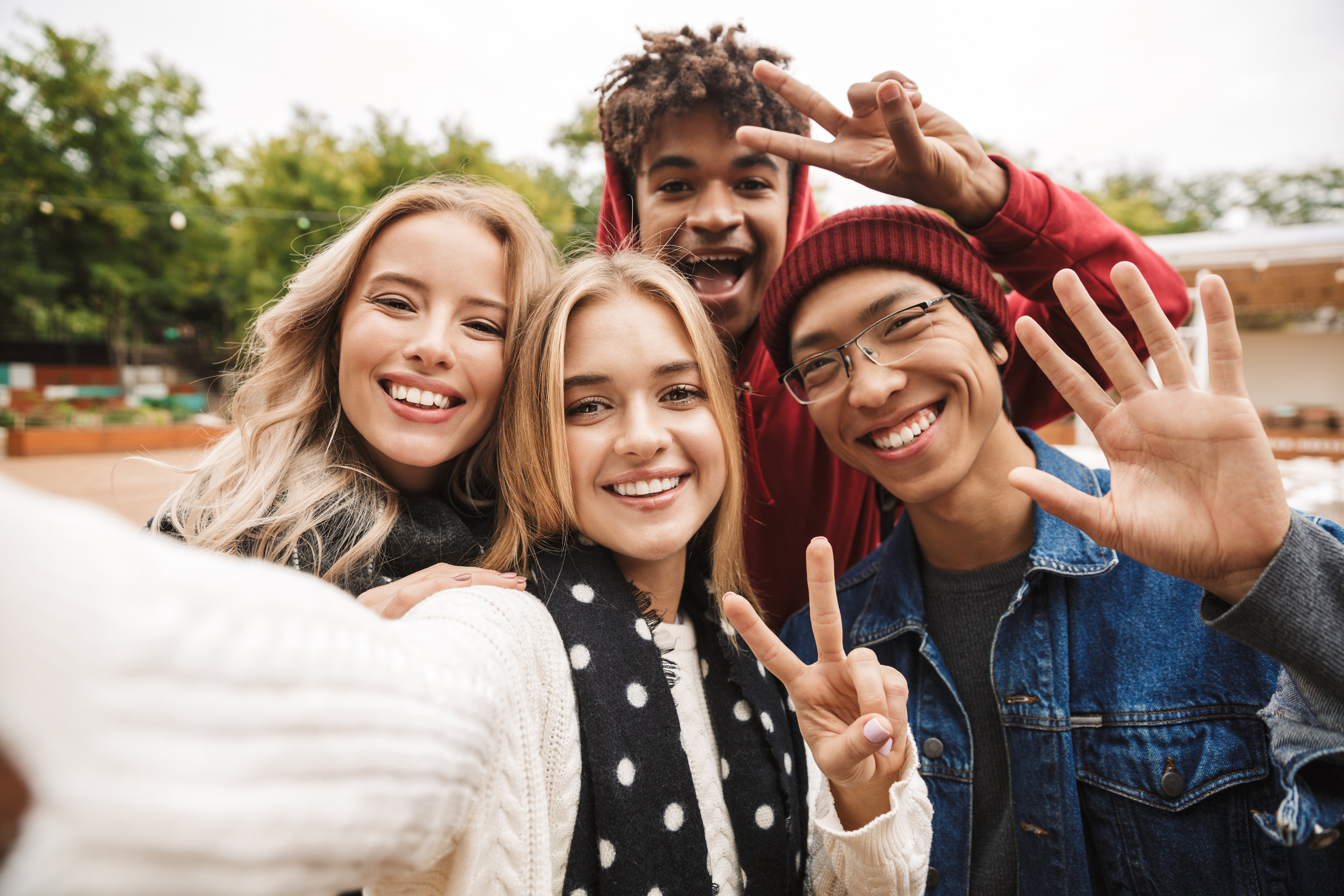 Students taking a group selfie outdoors